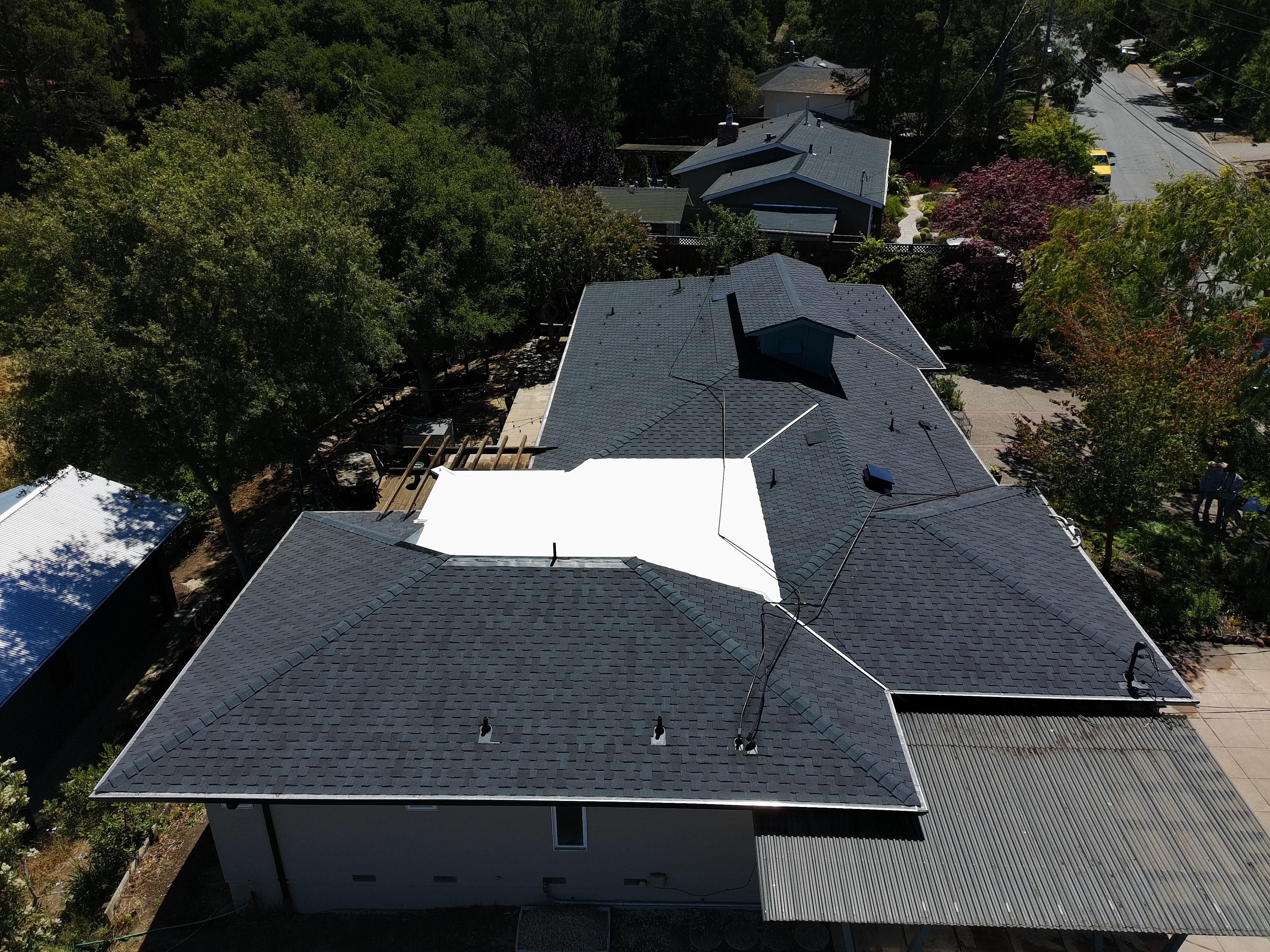 New Grand Sequoia RS shingle roof combined with a 60-mil white membrane.